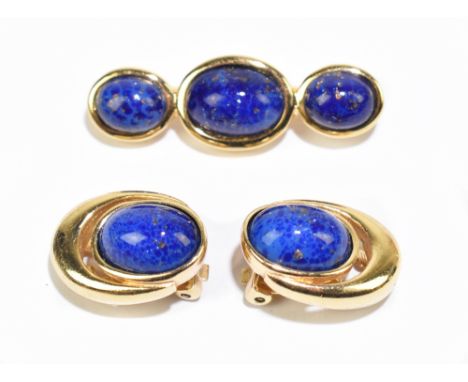 CHRISTIAN DIOR; a pair of gold tone vintage clip-on earrings with blue cabochon lapis lazuli stones, signed to clips, length 