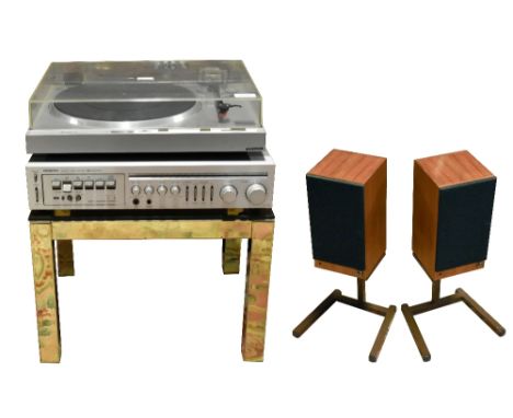 ONKYO; a cassette turner amplifier and a Hitachi model HT-40S turntable, both on a glass top gilt metal table with a pair of 