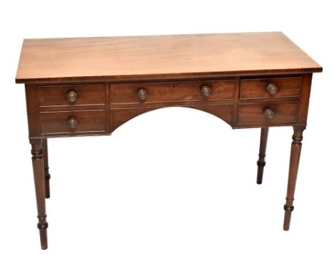 An early 19th century mahogany dressing table with an arrangement of five drawers on ring turned legs, height 76cm, width 114