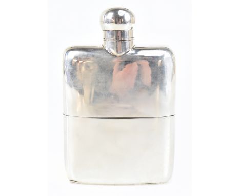 WILLIAM NEAL LTD; an Edwardian hallmarked silver hip flask with screw cap and solid silver body, London 1909, height 13.25cm.