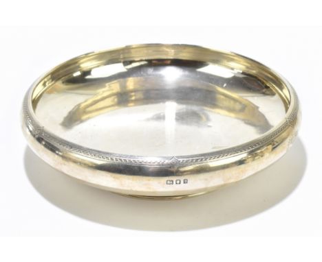 A George V hallmarked silver bowl with engraved rim and circular foot, London 1922, diameter 23cm, approx 16.3ozt/507.4g.Addi