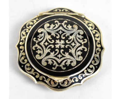 An Austrian silver and black enamel compact, decorated with foliate motifs, diameter 6cm.Additional InformationThe interior w