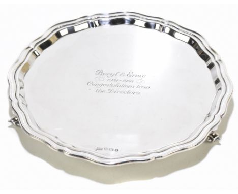 VINERS; an Elizabeth II hallmarked silver salver with cast border, raised on three scrolling feet, inscribed 'Beryl &amp; Ern