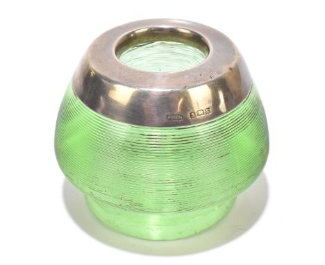 A George V halmarked silver mounted green glass match strike, Birmingham 1917, height 6cm.Additional InformationThe silver wi
