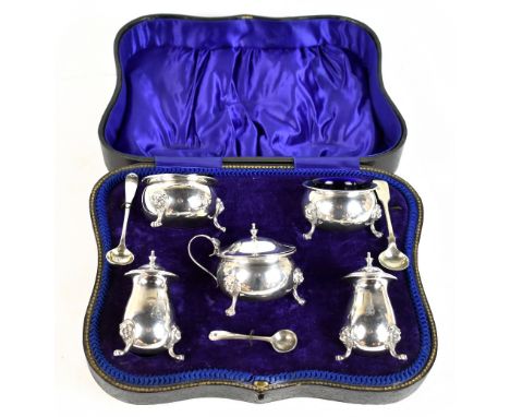 JOSEPH GLOSTER; a George V hallmarked silver five piece cruet, each with engraved initial B and supported on lion mask legs w