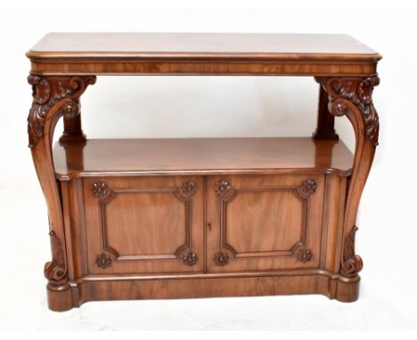 A Victorian mahogany buffet, with elaborately carved cabriole supports, with two base cupboard doors, raised on plinth base, 