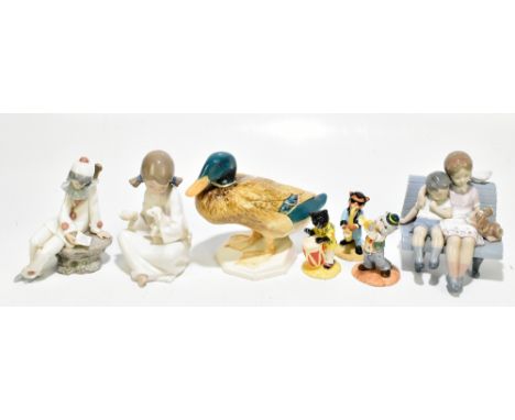 LLADRO; a boxed figure 'Surrounded by Love', together with two Nao figures including a seated Pierrot with lute, a Beswick fi