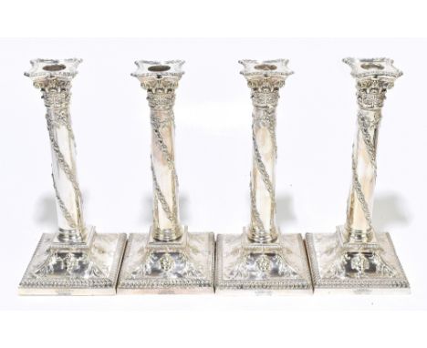 GOLDSMITHS &amp; SILVERSMITHS CO; a set of four late 19th century silver plated Adam style candlesticks, each with a detachab