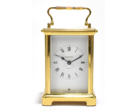 BAYARD; a French gilt brass eight day carriage timepiece, the enamelled dial set with Roman numerals, height 12cm.Additional 