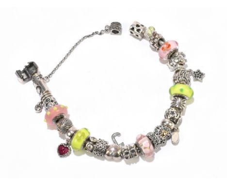 PANDORA; a boxed charm bracelet with seventeen charms, two spacers, five Murano glass charms and safety chain, length 20.5cm,