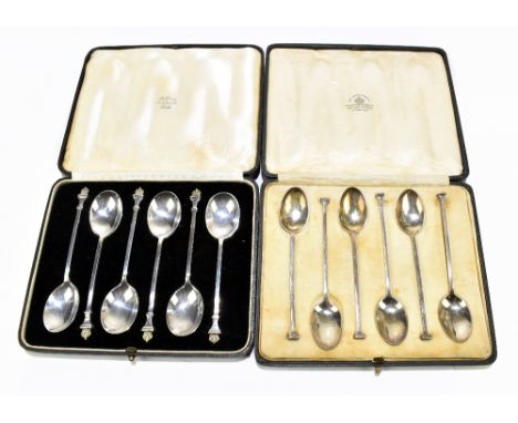 A set of six hallmarked silver teaspoons, each terminal decorated with a gilt crown, London 1928, together with a set of six 