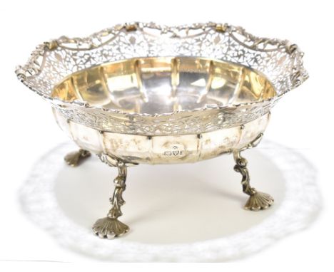 ADIE BROS; a substantial&nbsp; George V hallmarked silver bowl with shaped pierced rim, lobed main body and raised on four sc