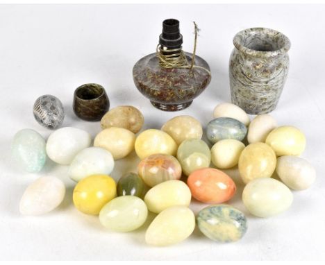 A collection of twenty-six stone and onyx eggs, a marble vase, a marble lamp and a smaller marble vase, the tallest 12cm.