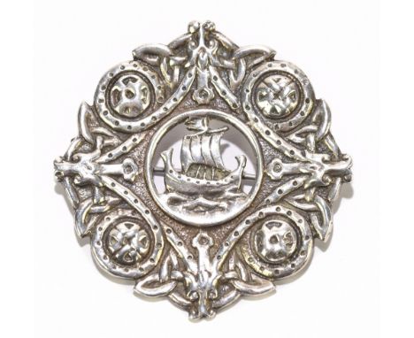 A George V hallmarked silver Scottish kilt pin centred with Viking ship within Celtic adorned frame, no.172 inscribed 'Made i