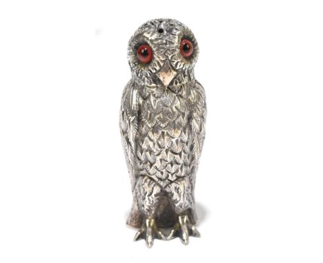 THOMAS SMILEY; a Victorian hallmarked silver novelty pepperette modelled as an owl, with amber glass eyes, London 1875, heigh