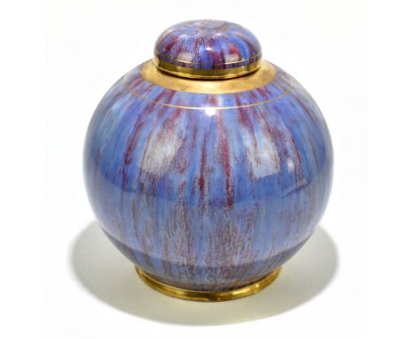 A contemporary ceramic lidded jar of bulbous form with gilt linear decoration on a sang de boeuf body, unmarked, height 24.5c