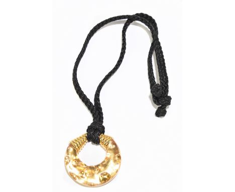 CHRISTIAN DIOR; a large vintage gold tone and resin pendant made in 1995 to promote the launch of the fragrance 'Dolce Vita' 