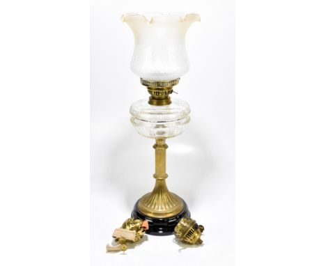 An early 20th century brass oil lamp with cut glass reservoir and later frosted glass shade, converted to electricity, height