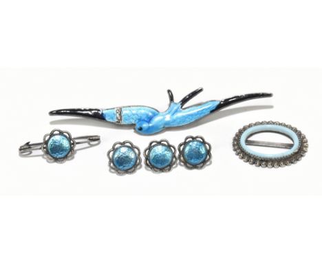 CHARLES HORNER; a set of George V hallmarked silver brooch/pin and buttons, each piece with central blue enamelled roundel wi