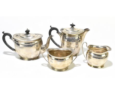 ELKINGTON &amp; CO; a George V hallmarked silver three piece tea service, with ebonised finials and handles, Birmingham 1941,