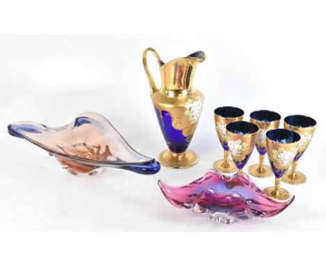 Two 1960's coloured glass dishes, the longest 48cm, with a five piece blue glass part drinks set (7)Additional InformationLig