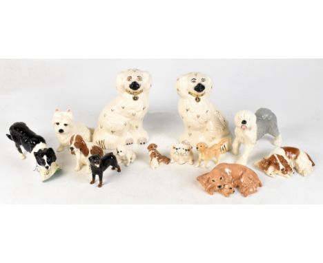 ROYAL DOULTON; a collection of six ceramic figures of dogs comprising a sheepdog, a spaniel and pup in two colour variations,