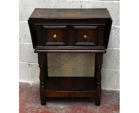 A reproduction oak drop leaf side table in the Jacobean style with single drawer above magazine shelf undertier, height 85cm,