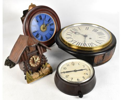 An early 20th century postman's clock with blue Roman numeral dial and movement striking on a bell, diameter 27cm, together w