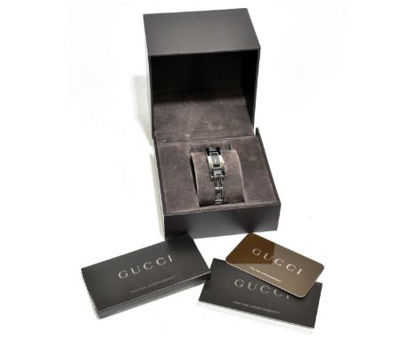 GUCCI; a 3900L silver stainless steel lady's quartz watch with Swiss movement and analogue display, no.033967, the watch stra