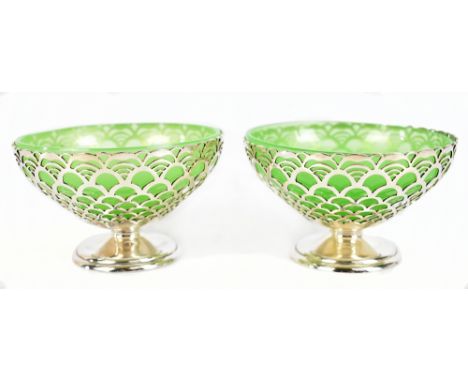 MAPPIN &amp; WEBB; a pair of George VI hallmarked silver bonbon dishes with green glass liners, the bodies with pierced decor