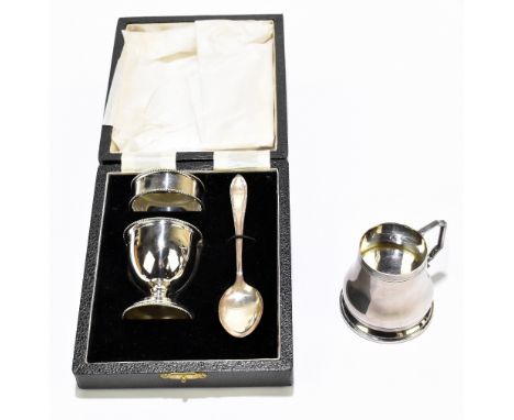 W.I BROADWAY &amp; CO; an Elizabeth II hallmarked silver cased three piece christening set, Birmingham 1968, together with a 