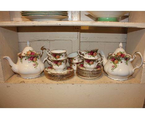 A Royal Albert Old Country Roses tea set with two teapots and six tea cups, saucers and cake plates