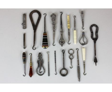A collection of various button hooks and similar, including two Victorian with silver handles, three with carved bone handles