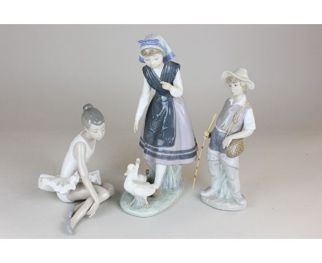 Two Lladro porcelain figures of a girl with ducks and a boy with fishing rod, together with a Nao figure of a ballerina