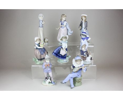 A collection of six Lladro figures of boys and girls in various poses, together with two Nao figures of a clown and a girl wi