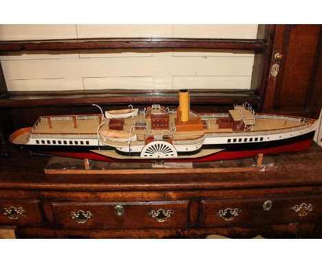 A scratch built painted metal and wood model ship with steam powered engine, on stand, 126cm long