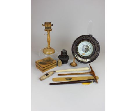 A small collection of treen to include a carved bone whistle, miniature wooden pick axe, a souvenir thread holder from Blackp