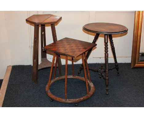 Three various occasional tables including a Victorian rosewood circular tripod table, an Arts and Crafts oak hexagonal table 