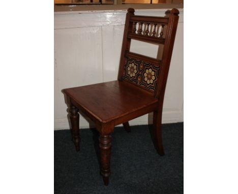 An oak hall chair with tile back, on turned legs