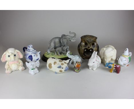 A Royal Worcester robin figure, a Peter John pottery owl candle holder, a Steiler studio pottery pig and a collection of elep