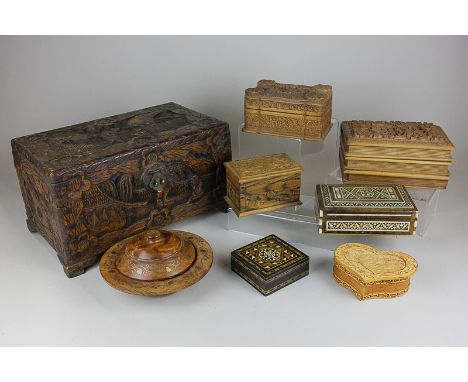 A collection of eight various carved and inlaid wooden boxes, five carved with floral and naturalistic designs, another inlai
