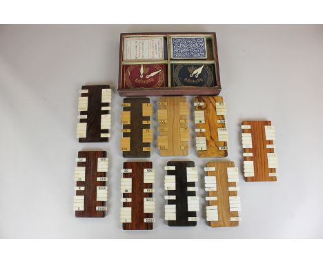 A collection of Bezique markers including the Camden the Club and Muddies, with two packs of playing cards