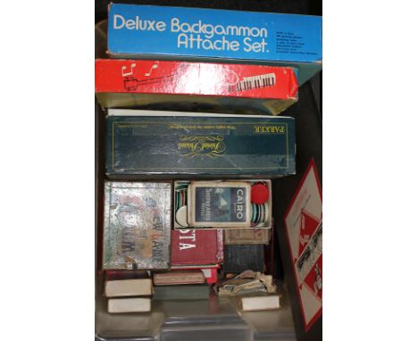 A collection of various board and card games, to include Backgammon, Monopoly, Reversi and Halma