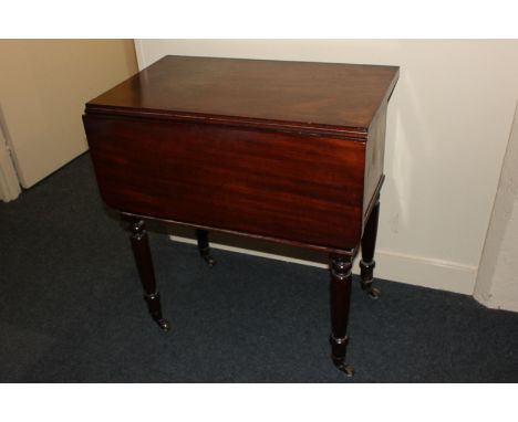 An unusual mahogany pot cupboard, in the form of a drop leaf side table with button operated hinged front, enclosing racked i