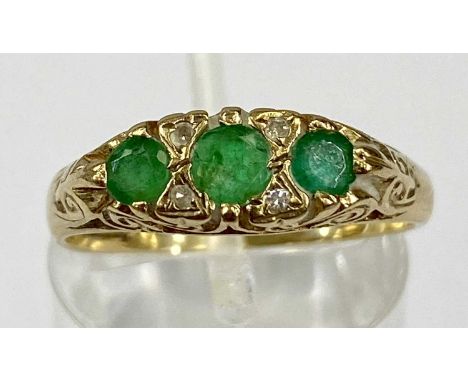 9CT GOLD EMERALD & DIAMOND SEVEN STONE RING, Celtic style scroll setting, size P, Birmingham date stamp 1997, 2.9gmsProvenanc