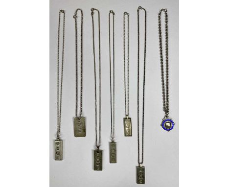 SIX SILVER INGOT NECKLACES & ONE OTHER, presumed silver fob medallion with blue enamel ring surrounding a 1933 date on a late