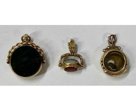 TWO 9CT GOLD SWIVEL FOBS & A GEM SET HAIR FOB, the first set with three various hardstones, 24 x 17mm, 4.1gms stamped '9-375'