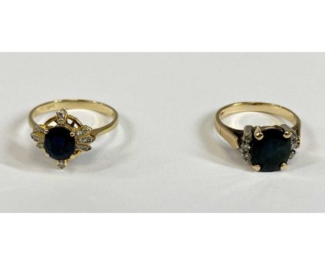 TWO 14CT GOLD DIAMOND & BLUE SAPPHIRE SET DRESS RINGS, the first with sixteen small diamonds shouldering a facet cut blue sap