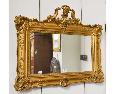 A Gilt Framed Rectangular Hanging Wall Mirror, with openwork pediment adorned with a portrait bust of a gentleman, 84cm by 70