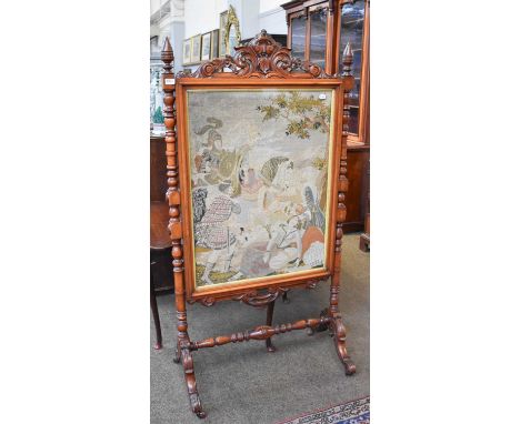 A Large Victorian Tapestry Firescreen, with carved and turned mahogany frame, 86cm by 105cm by 165cmFrame is structurally sou